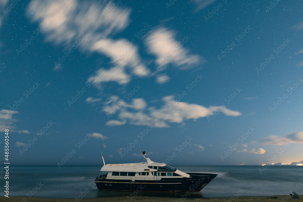 boat wreck with stars and clouds