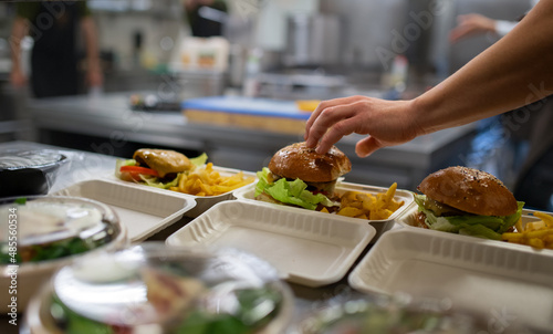 Meals in containers prepared for take away in kitchen restaurant.