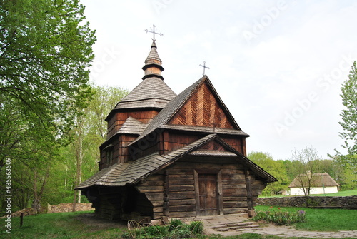 An old wooden church in Ukraine. Rural landscape with a church. Wooden Ukrainian church. The green landscape of the countryside. Kiev. Ukraine.
