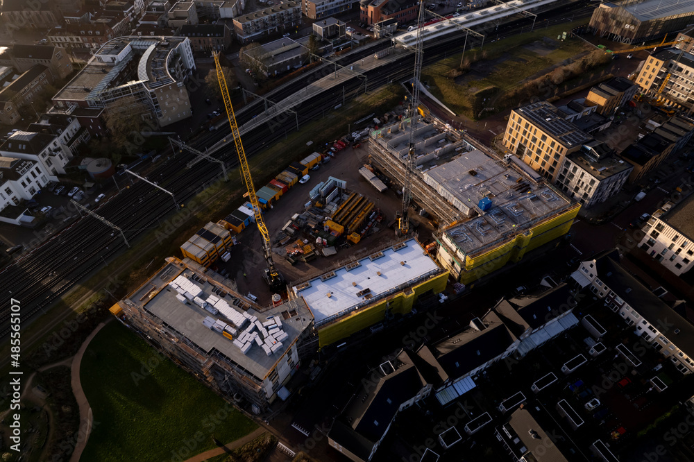 Aerial of Ubuntuplein construction site in urban development of real estate investment project in new 
Noorderhaven neighbourhood. Housing shortage and engineering concept.