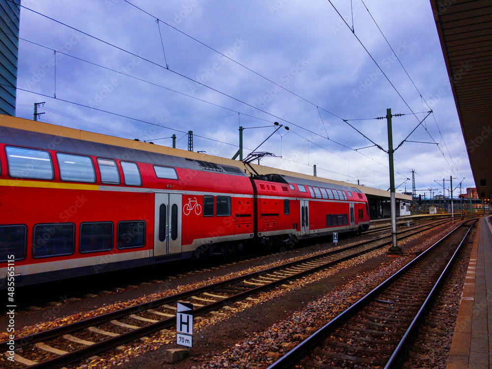 Platform, rails, train with locomotives on station
