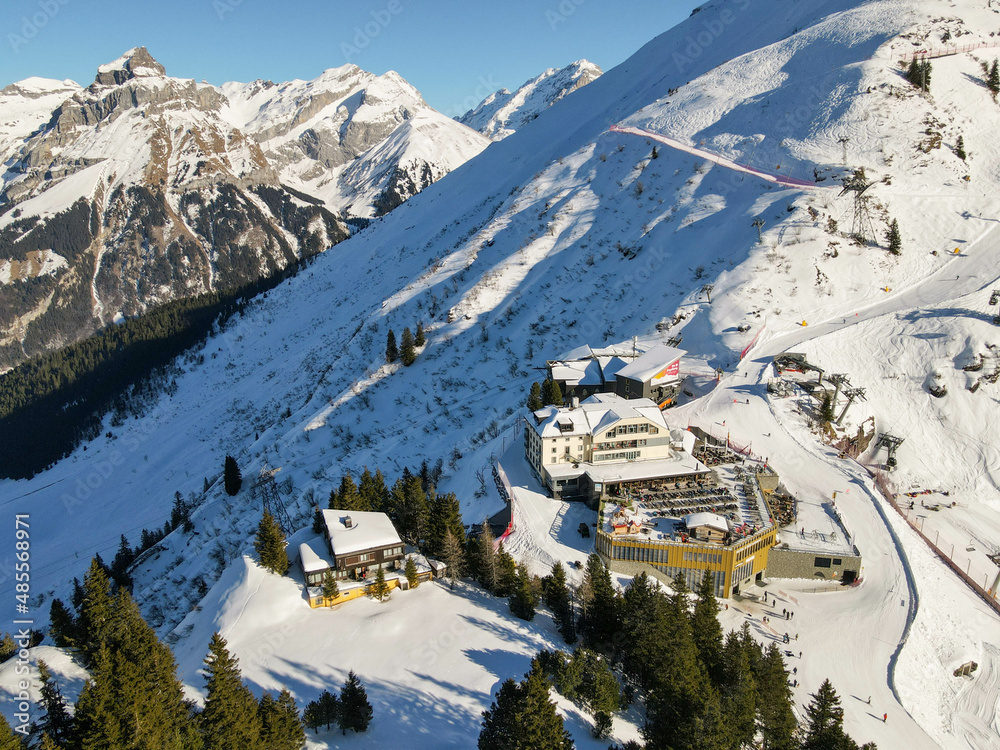 Drone view at Truebsee station over Engelberg in the Swiss alps