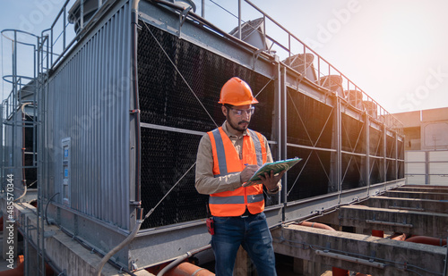 Wallpaper Mural engineer under checking the industry cooling tower air conditioner is water cooling tower air chiller HVAC of large industrial building to control air system. Torontodigital.ca