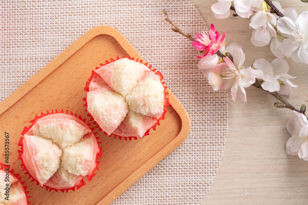 Cute Chinese steamed sponge cake - Fa Gao on wooden table background for spring festival celebration food.