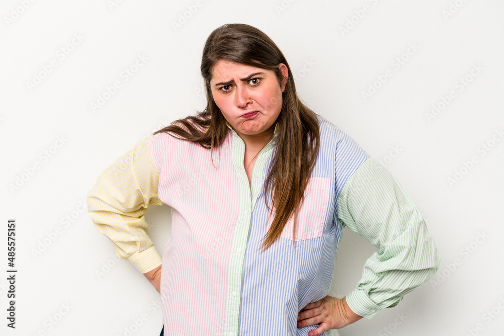 Young caucasian overweight woman isolated on white background confused, feels doubtful and unsure. Young caucasian overweight woman isolated on white background confused, feels doubtful and unsure.