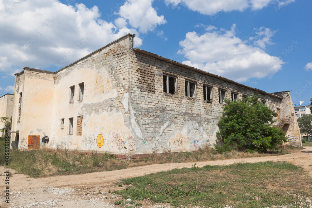 A crumbling building on Kirov street in the village of Uyutnoye, Saksky district, Crimea A crumbling building on Kirov street in the village of Uyutnoye, Saksky district, Crimea