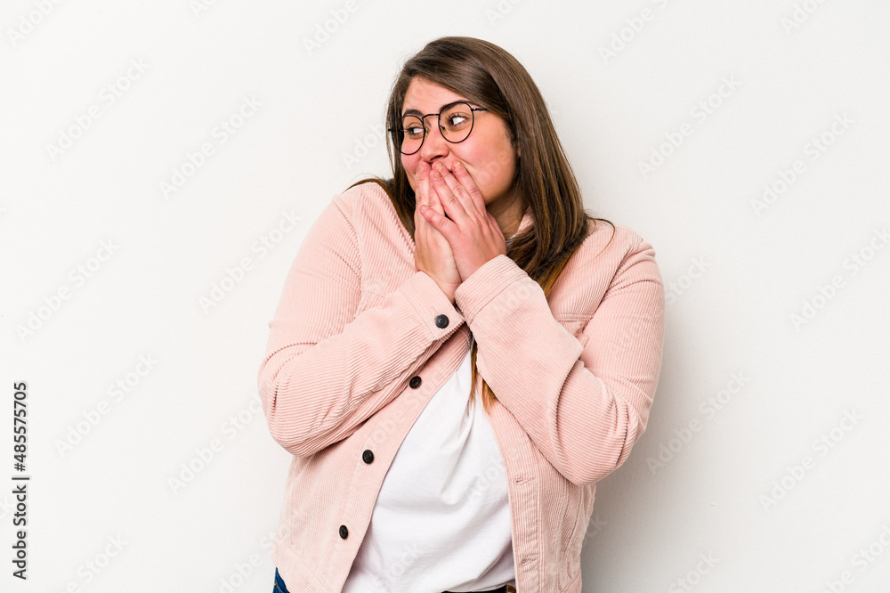 Young caucasian overweight woman isolated on white background laughing about something, covering mouth with hands. Young caucasian overweight woman isolated on white background laughing about something, covering mouth with hands.