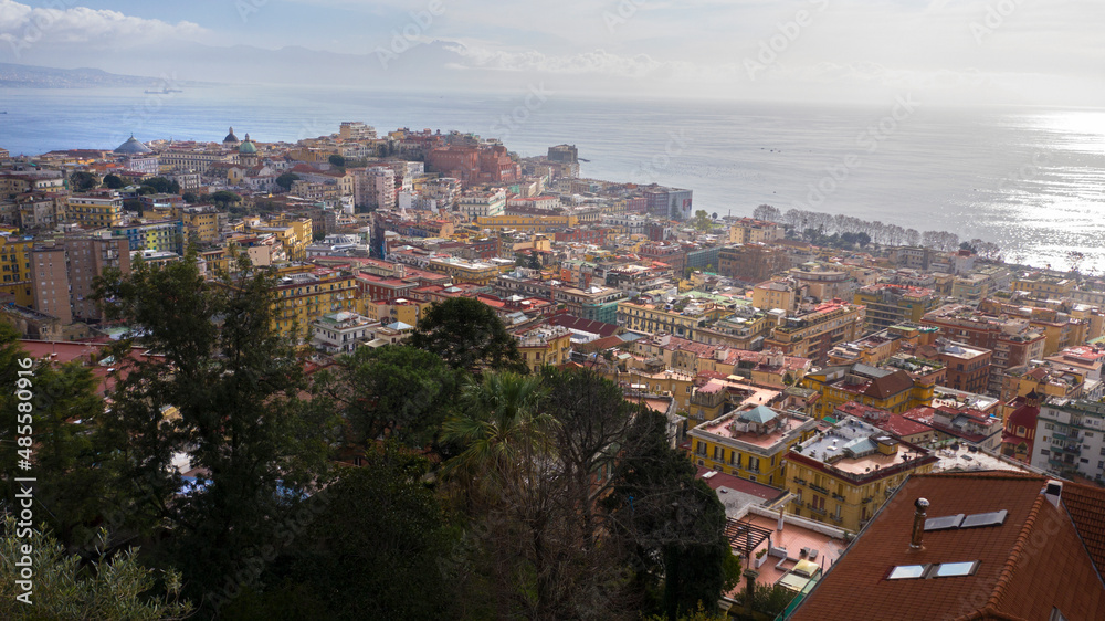Aerial view of the city of Naples and the seafront of Mergellina on a sunny day.