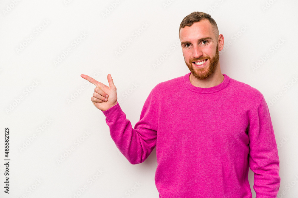 Young caucasian man isolated on white background smiling cheerfully pointing with forefinger away. Young caucasian man isolated on white background smiling cheerfully pointing with forefinger away.