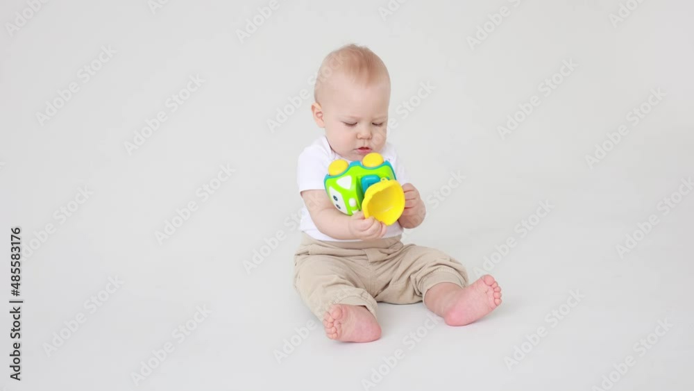 toddler boy playing with car toy on white background isolated toddler boy playing with car toy on white background isolated