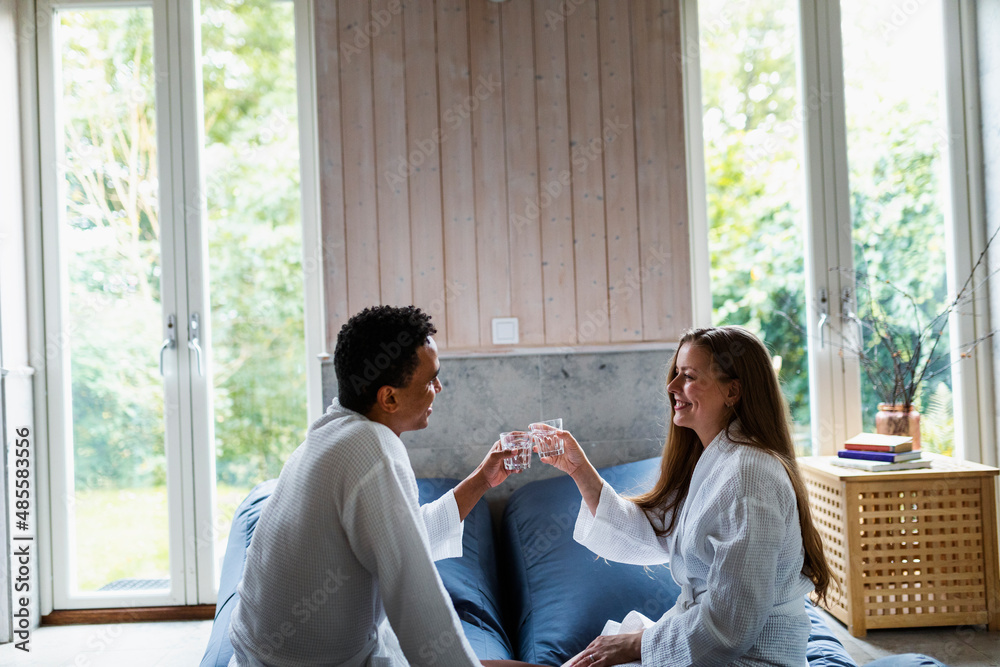 Couple relaxing together in living room Couple relaxing together in living room