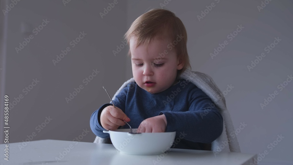Adorable Cute Caucasian Baby Toddler Girl Eating Pieces of Sweet Orange Fruit using Small Fork and Hand Closeup BLW Baby LEad Weaning Adorable Cute Caucasian Baby Toddler Girl Eating Pieces of Sweet Orange Fruit using Small Fork and Hand Closeup BLW Baby LEad Weaning
