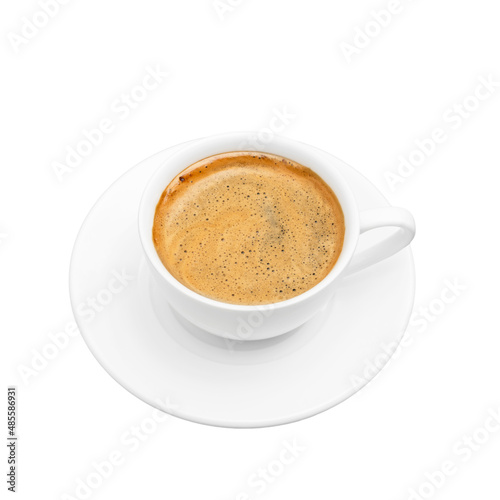 Black coffee with foam in a white cup on plate, isolated at white background