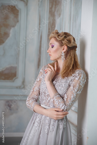 Portrait of a beautiful bride girl with a gentle elegant hairstyle. © ksi