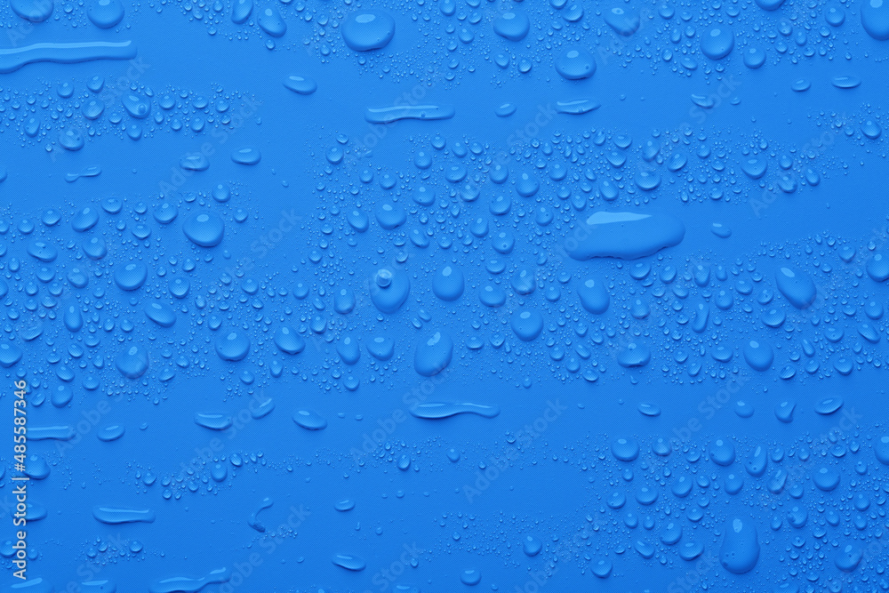 Water drops on blue color surface Water drops on blue color surface