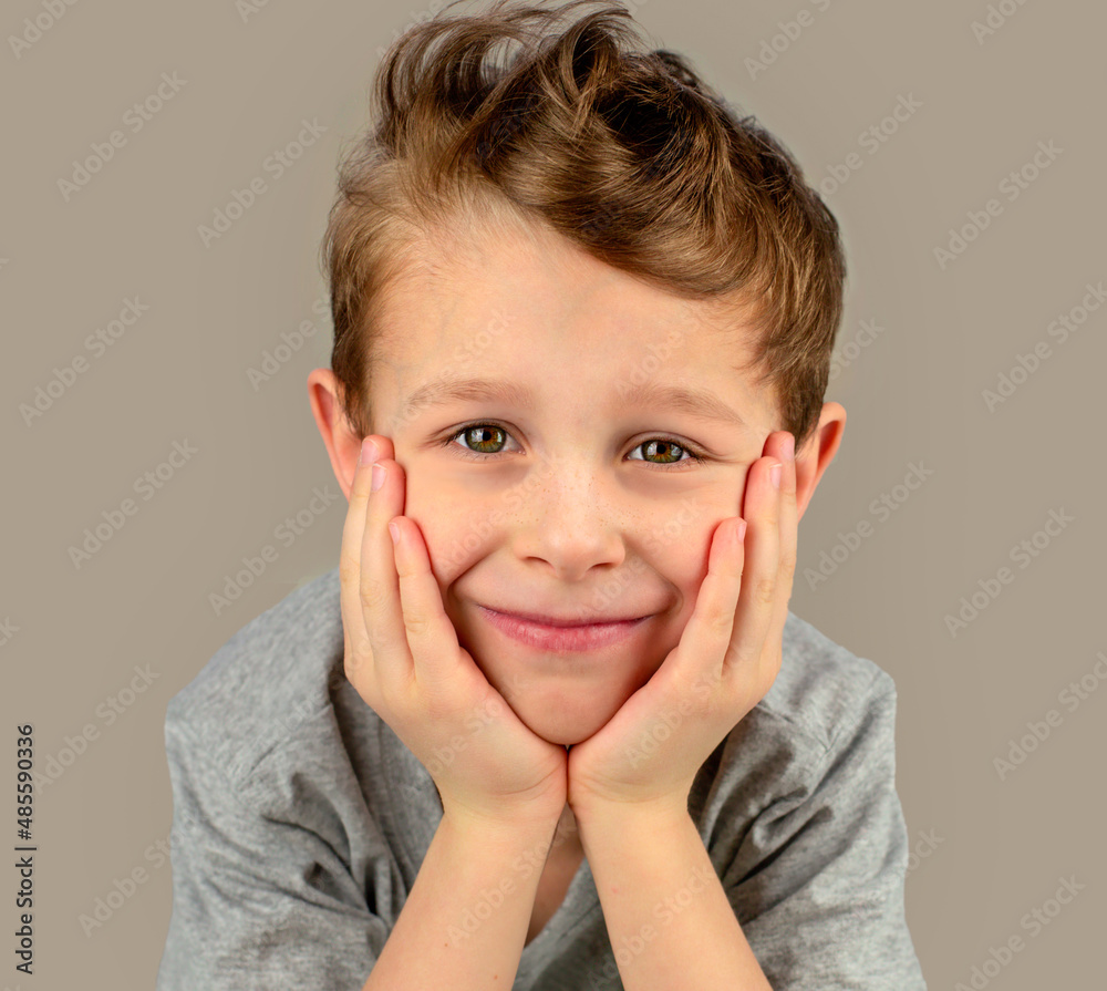 Smiling boy looks directly into the camera. Portrait. Emotions Smiling boy looks directly into the camera. Portrait. Emotions