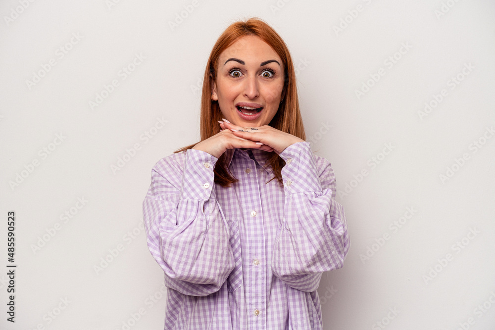 Young caucasian woman isolated on white background praying for luck, amazed and opening mouth looking to front. Young caucasian woman isolated on white background praying for luck, amazed and opening mouth looking to front.