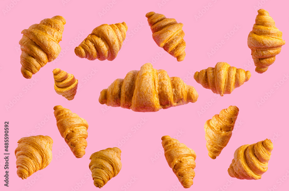 croissant levitation print on pink background croissant levitation print on pink background