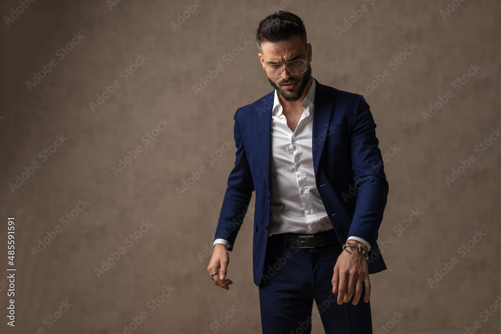 businessman looking down, being dramatic and posing businessman looking down, being dramatic and posing