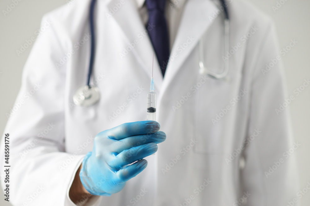 Professional medical doctor in hospital office. Portrait of young and confident physician. Medical concept. Professional medical doctor in hospital office. Portrait of young and confident physician. Medical concept.
