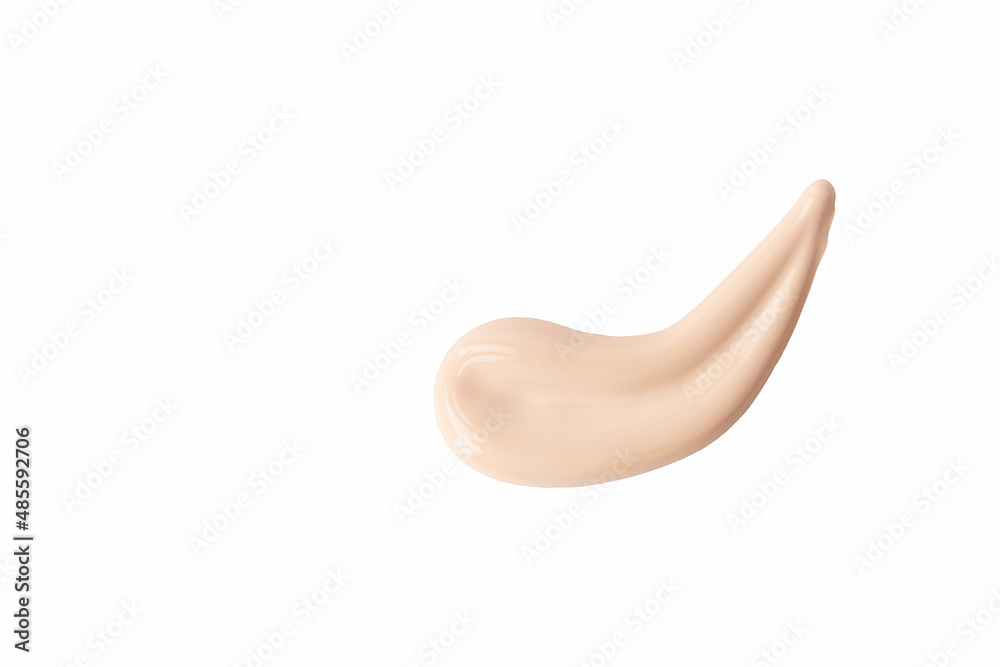Beige nude cosmetic cream swatch isolated on white background. Creamy texture of foundation for facial skin, top view