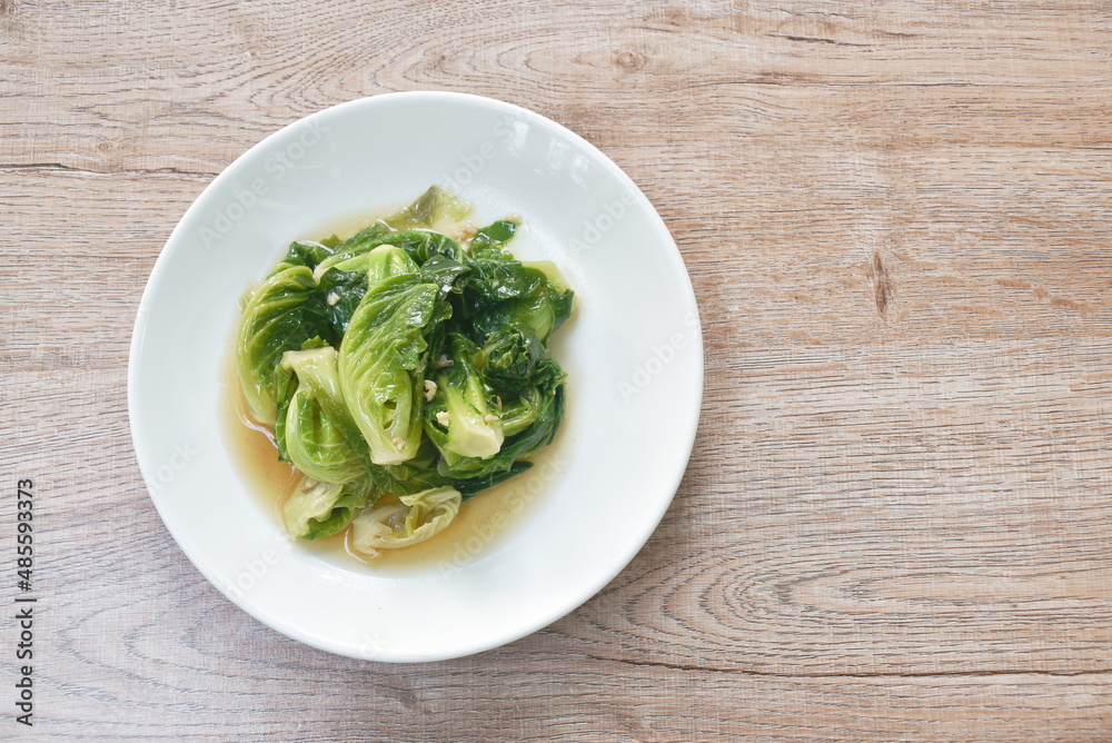 fried Brussels sprout in oyster sauce on plate fried Brussels sprout in oyster sauce on plate
