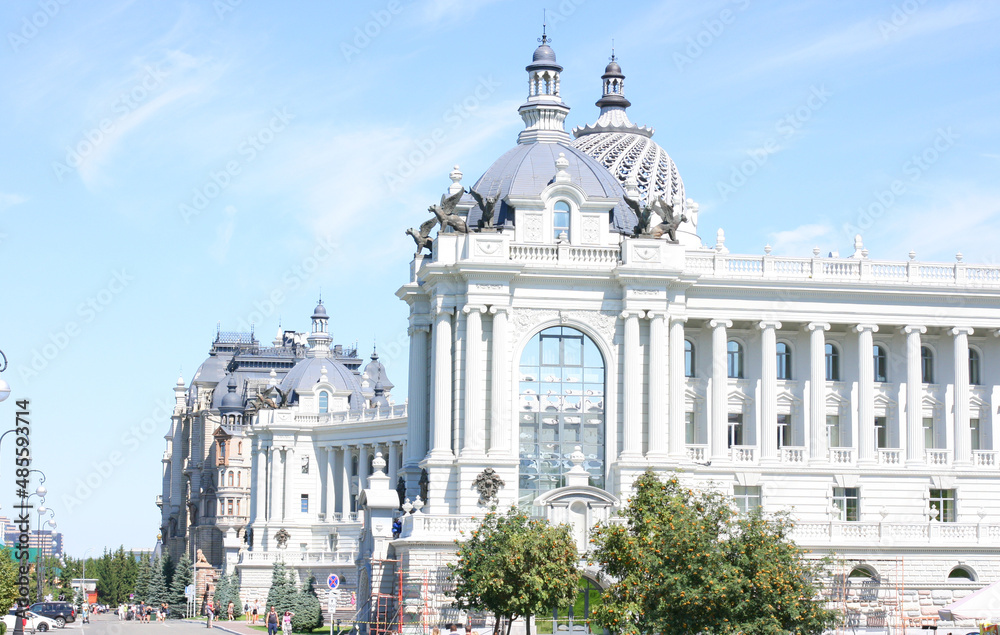 Tatarstan, Russia July 21 2021 - View of beautiful green park and Farmers Palace (Ministry of Environment and Agriculture) in Kazan city center. This place is landmark of Kazan.