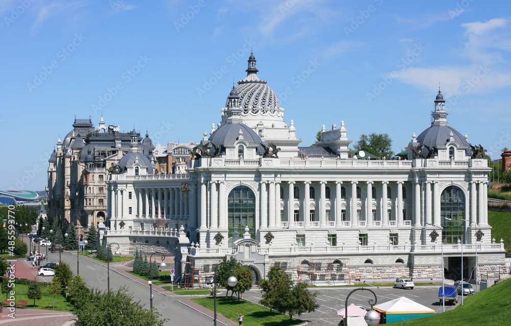 Obraz premium Tatarstan, Russia July 21 2021 - View of beautiful green park and Farmers Palace (Ministry of Environment and Agriculture) in Kazan city center. This place is landmark of Kazan.