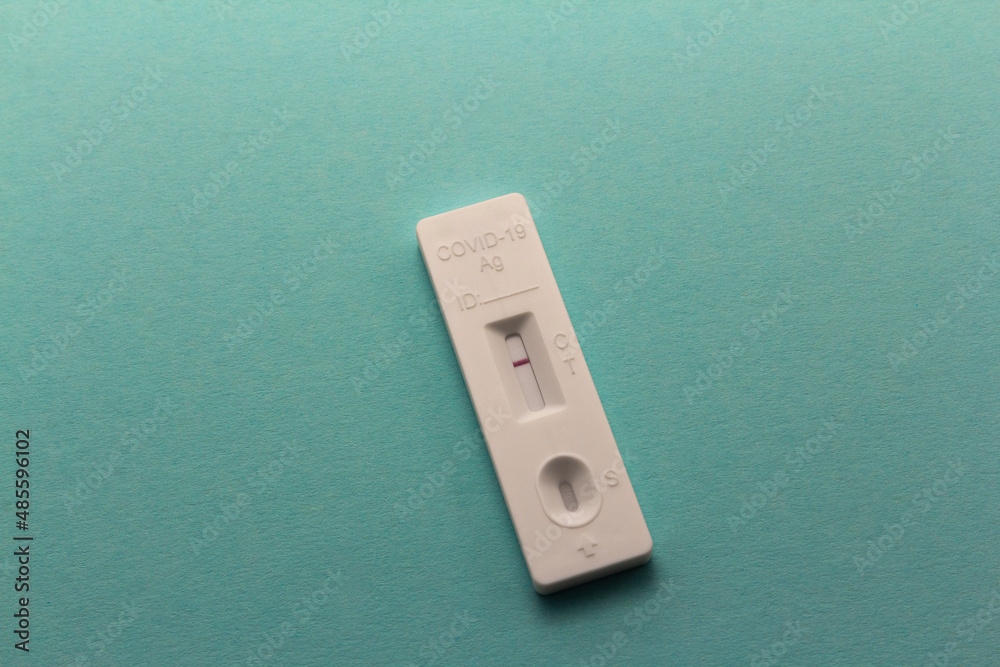 Negative SARS-CoV-2 Rapid Antigen Test on aqua blue background, horizontal copy space Negative SARS-CoV-2 Rapid Antigen Test on aqua blue background, horizontal copy space