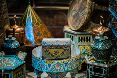 Marrakesh, Morocco - February 28, 2018: All kinds of souvenirs exhibited in a shop in the ancient district of Medina in Marrakech.
