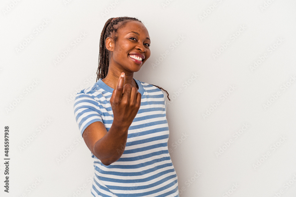 Young african american woman isolated on white background pointing with finger at you as if inviting come closer. Young african american woman isolated on white background pointing with finger at you as if inviting come closer.