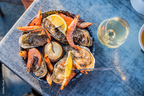 Delicious seafood with wine in restaurant photo