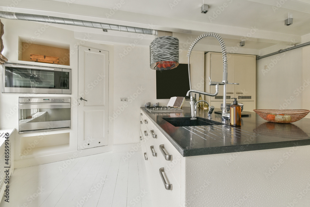 Kitchen counter with dishware in apartment Kitchen counter with dishware in apartment