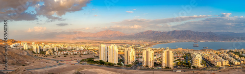 Eilat and Aqaba are famous resort cities with thousands relaxing tourists fro...