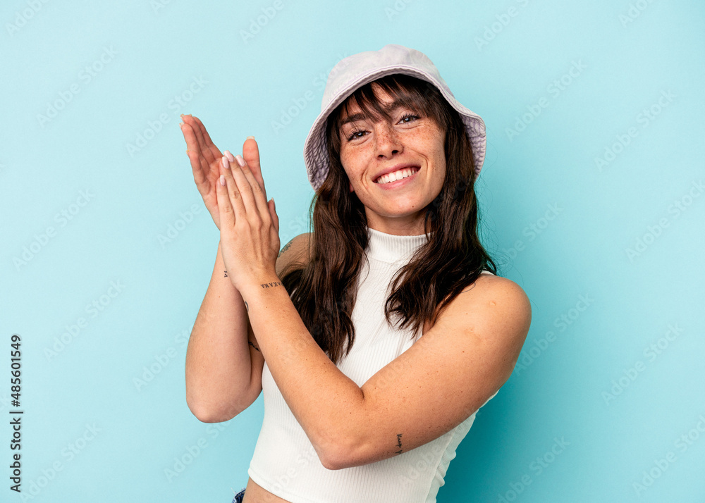 Young Argentinian woman isolated on blue background feeling energetic and comfortable, rubbing hands confident. Young Argentinian woman isolated on blue background feeling energetic and comfortable, rubbing hands confident.