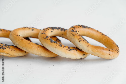 Dried bagels with poppy seeds on a white background
