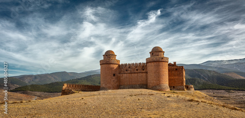 Panorama image of the impressive castle of Calahorra (Castillo de La Calahorra) in the foothills of the Sierra Nevada, Andalusia, Spain 