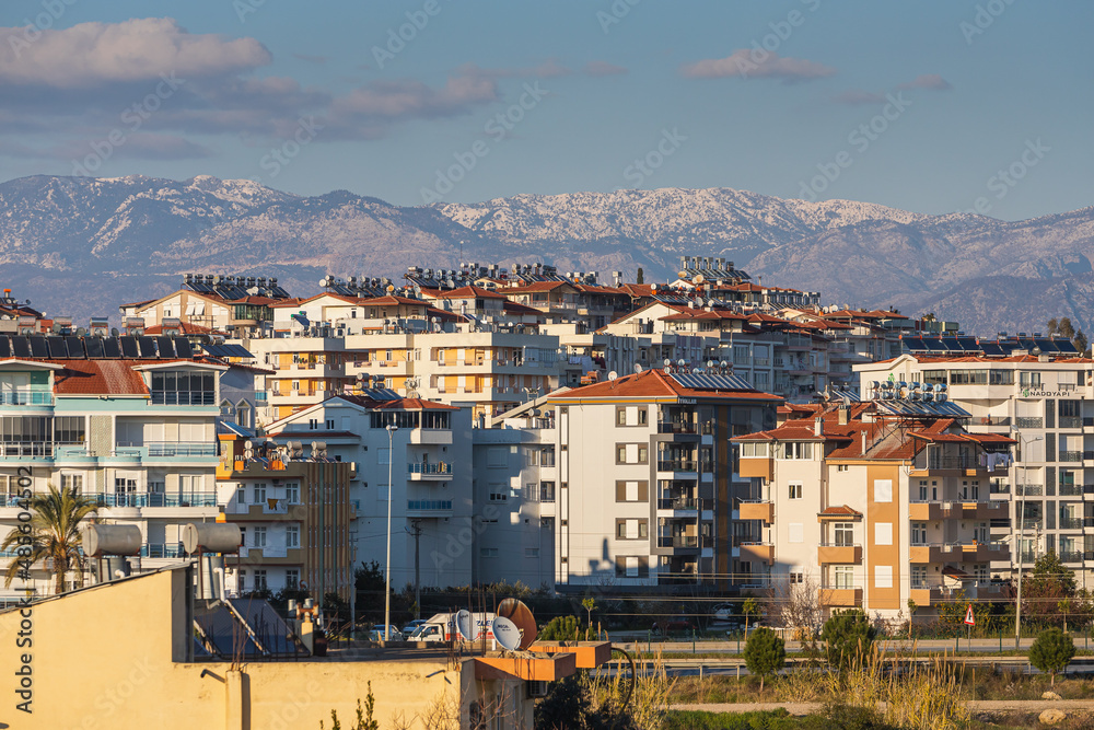 Colorful Turkish streets with  white houses, barrels of hot water on the roof and solar panels