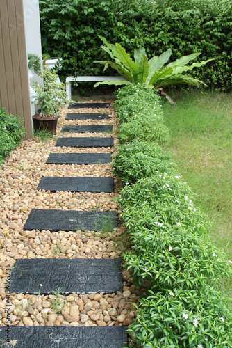 Black flagstone pathway in the garden.