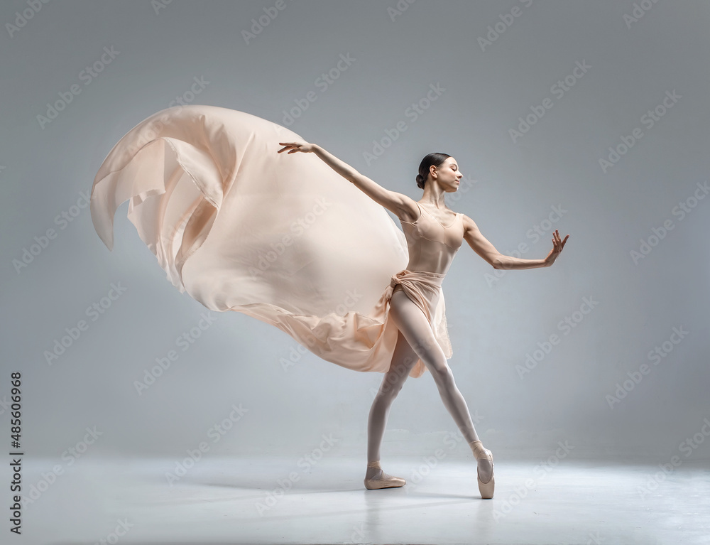Beautiful ballerina dancing in the body color ballet leotard with body color cloth. She danced on ballet pointe shoes. - obrazy, fototapety, plakaty 