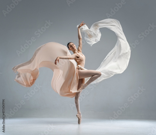 Obraz na płótnie Beautiful ballerina dancing in the body color ballet leotard with body color cloth