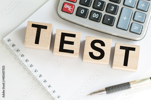 Business concept. Test text on wooden cubes on an office desk