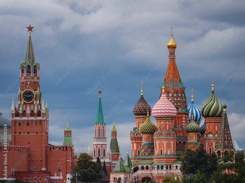 Fototapeta premium Beautiful view of Red Square with Moscow Kremlin and St. Basil's Cathedral in rainy summer. This is main tourist destination in Moscow. Beautiful panorama of heart of city.