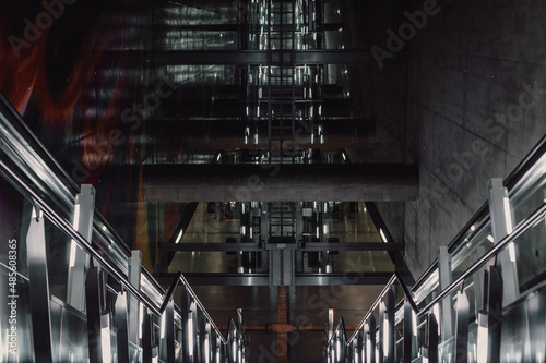 Escalator with blinding neon lights
