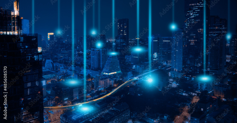 Smart city and wireless networking concept. Dot point connection technology with aerial view city background at night. - obrazy, fototapety, plakaty 