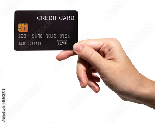 The woman's hand holds a black credit card isolated on white background.	
