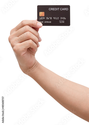 The woman's hand holds a black credit card isolated on white background. 