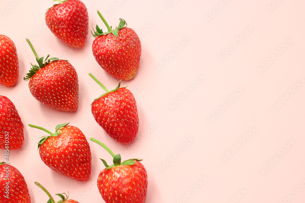 Fresh red strawberry pattern on isolated pink pastel background with copy space Fresh red strawberry pattern on isolated pink pastel background with copy space