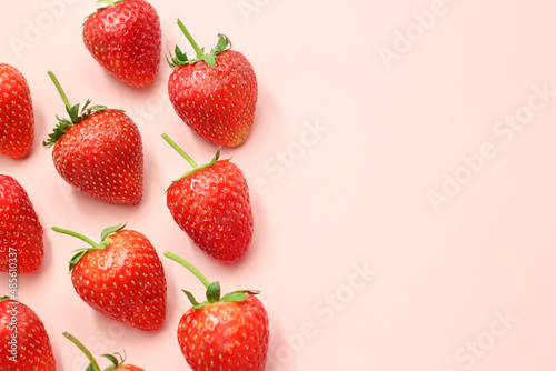 Fresh red strawberry pattern on isolated pink pastel background with copy space