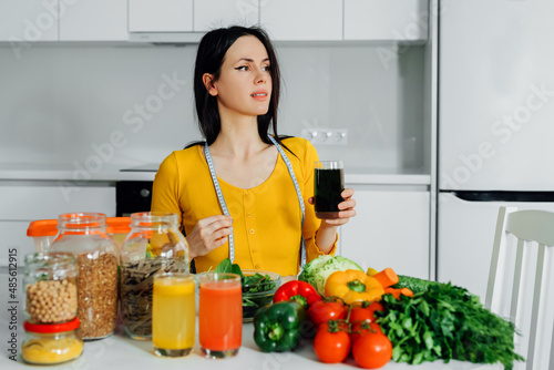 a women drink healthy green juice at home.Healthy lifestyle.Nutritions food